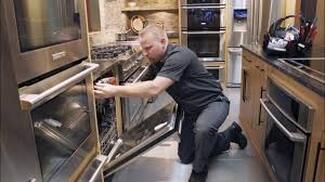Man repairing appliance